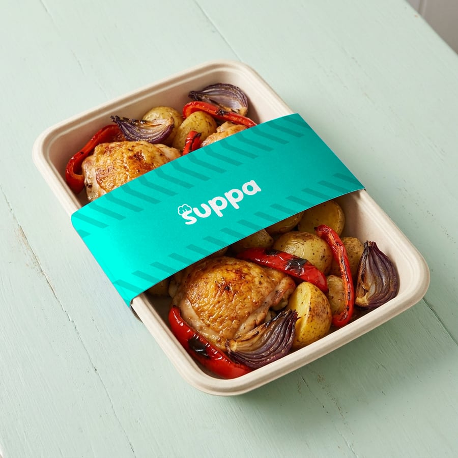 Roast chicken traybake packed in a Suppa tray with a teal striped sleeve