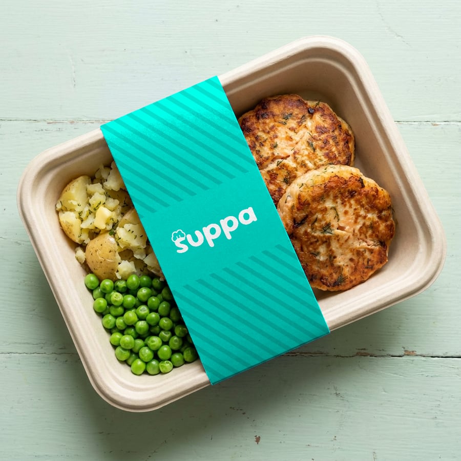 Salmon and dill fishcakes packed in a Suppa tray with a teal striped sleeve