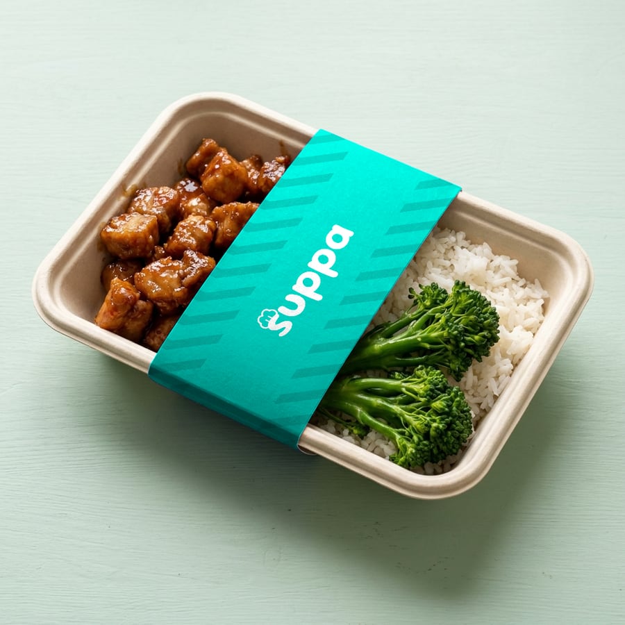 Honey garlic pork packed in a Suppa tray with a teal striped sleeve