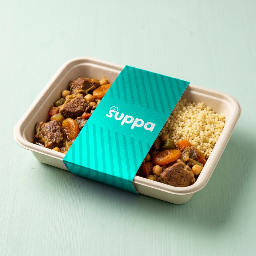 Lamb and apricot tagine packed in a Suppa tray with a teal striped sleeve