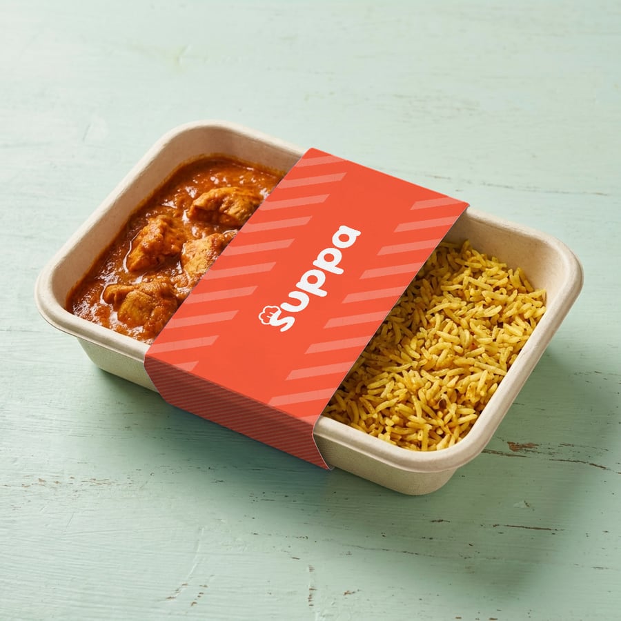 Chicken tikka masala packed in a Suppa tray with a orange striped sleeve