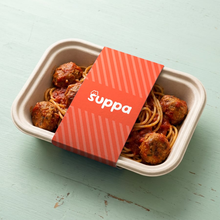 Turkey meatballs and spaghetti packed in a Suppa tray with a orange striped sleeve
