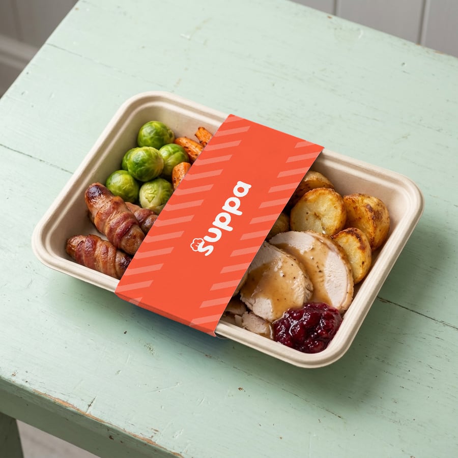 The Full Christmas packed in a Suppa tray with a orange striped sleeve