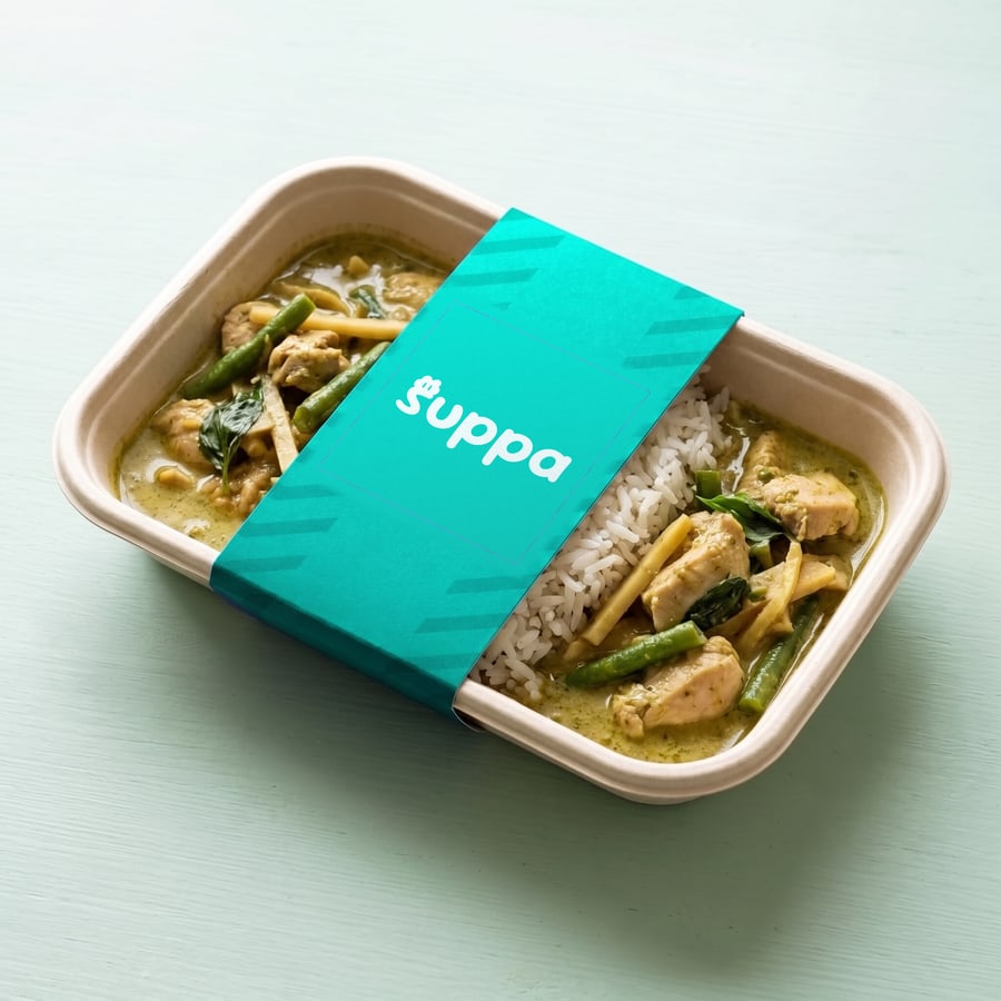 Thai green chicken curry packed in a Suppa tray with a teal striped sleeve