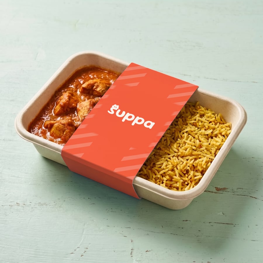 Chicken tikka masala packed in a Suppa tray with a orange striped sleeve