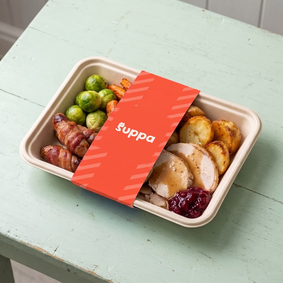 The Full Christmas packed in a Suppa tray with a orange striped sleeve