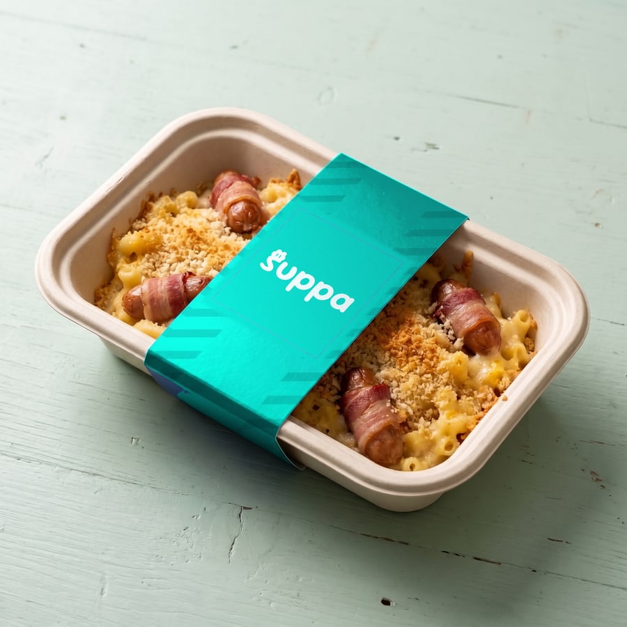 Pigs in Blankets Mac packed in a Suppa tray with a teal striped sleeve